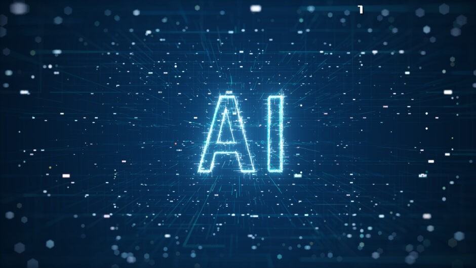 コンピュータ画面に映る「AI」のロゴ